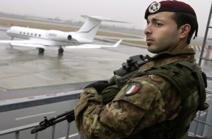 Italian army paratrooper guarding the Torino 2006 Winter Olympic Games keeps watch at Turin's airport