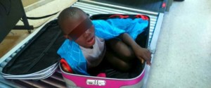 Handout photo of a boy is seen cramped inside a suitcase at the border security checkpoint between Spain's north african enclave Ceuta and Morocco