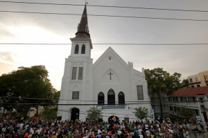 A crowd gathers outside the Emanuel African Methodist Episcopal Church following a prayer vigil nearby in Charleston
