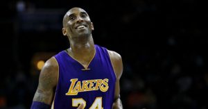 FILE In this Dec. 1, 2015 file photo Los Angeles Lakers' Kobe Bryant smiles as he jogs to the bench during the first half of an NBA basketball game against the Philadelphia 76ers in Philadelphia. The Retired NBA superstar has died in helicopter crash in Southern California, Sunday, Jan. 26, 2020. (AP Photo/Matt Slocum)